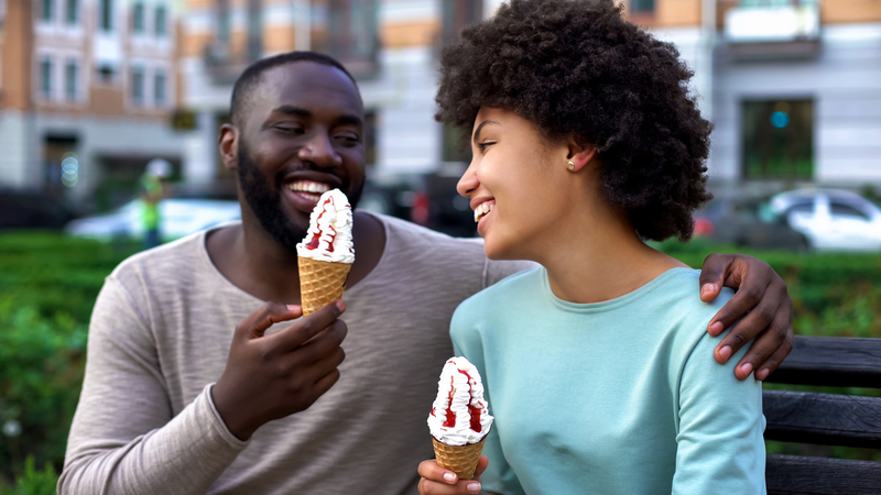 man and woman eating ice cream on a sober date