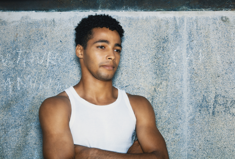 Young Latinx man, searching for harm reduction services or addiction treatment.