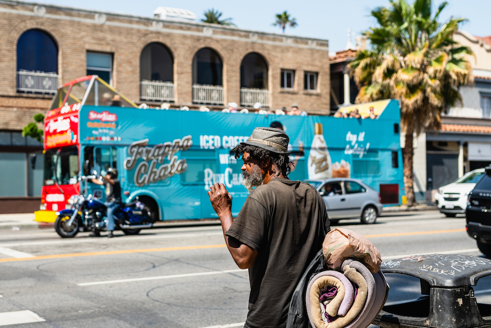 LA man without housing about to cross the street