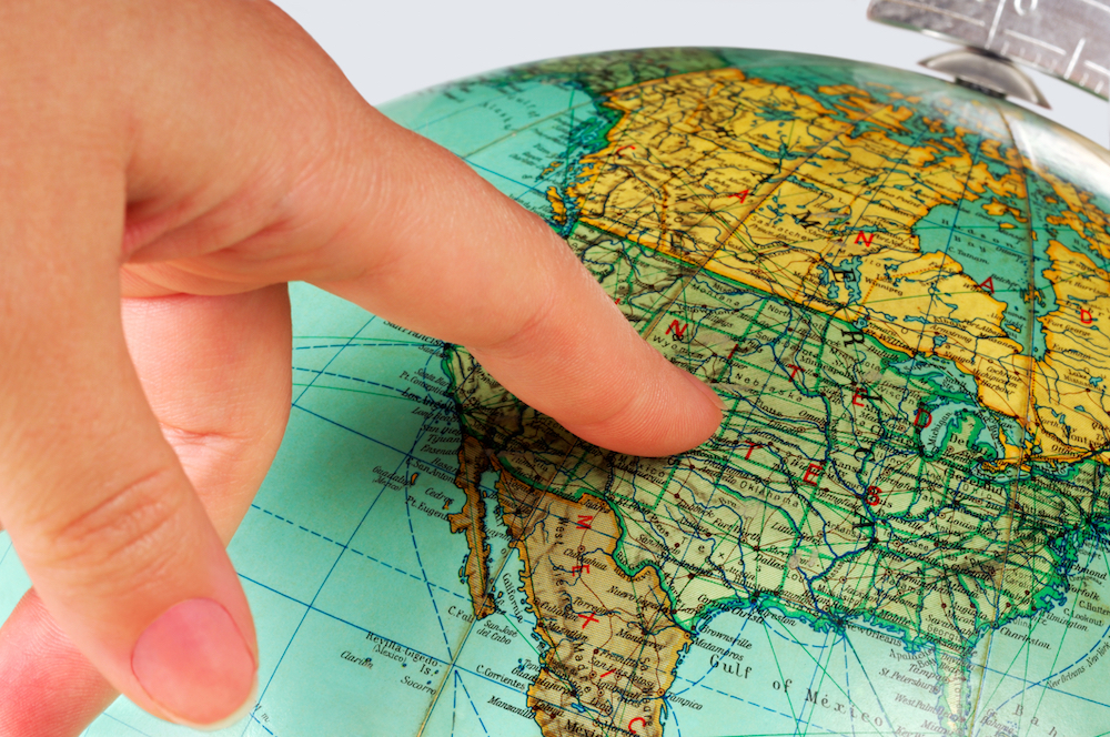 person pointing at map of high-risk counties for opioid deaths