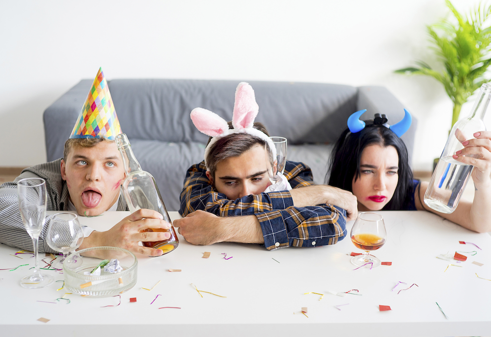 three people with hangovers