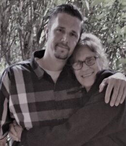 Harrison Leimert and Karen Hunt embracing