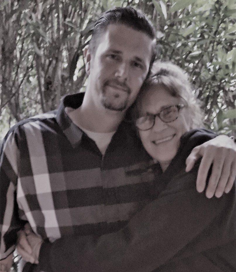 Harrison Leimert and Karen Hunt embracing