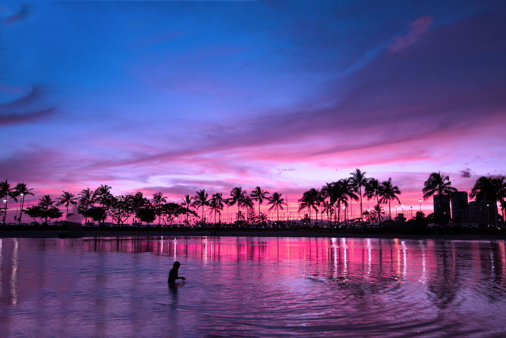 a person enjoying a sunset in Hawaii