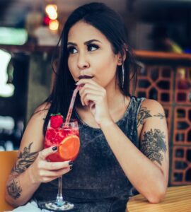 Woman drinking non-alcoholic cocktail, sober curious