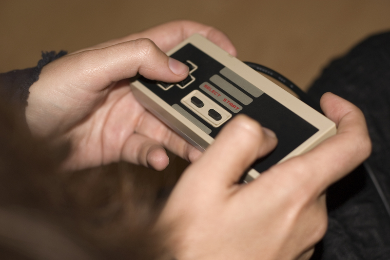 A retro video game console controller