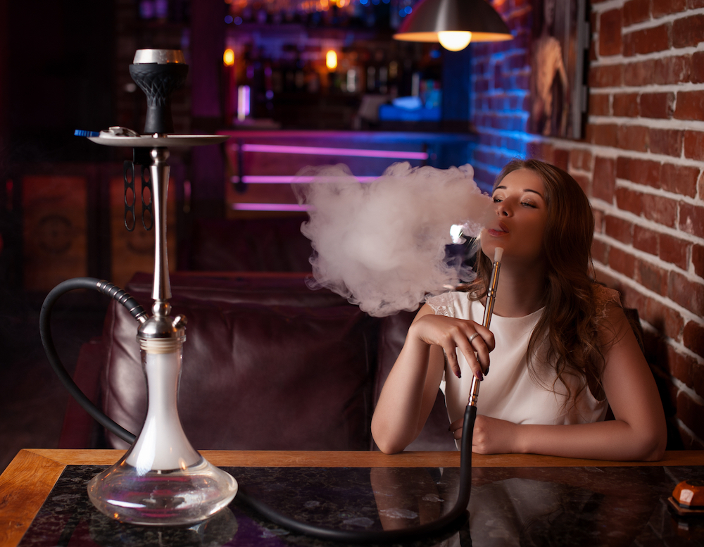 a person smoking hookah