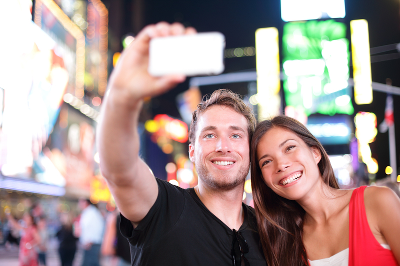 young couple on a sober date taking a selfie