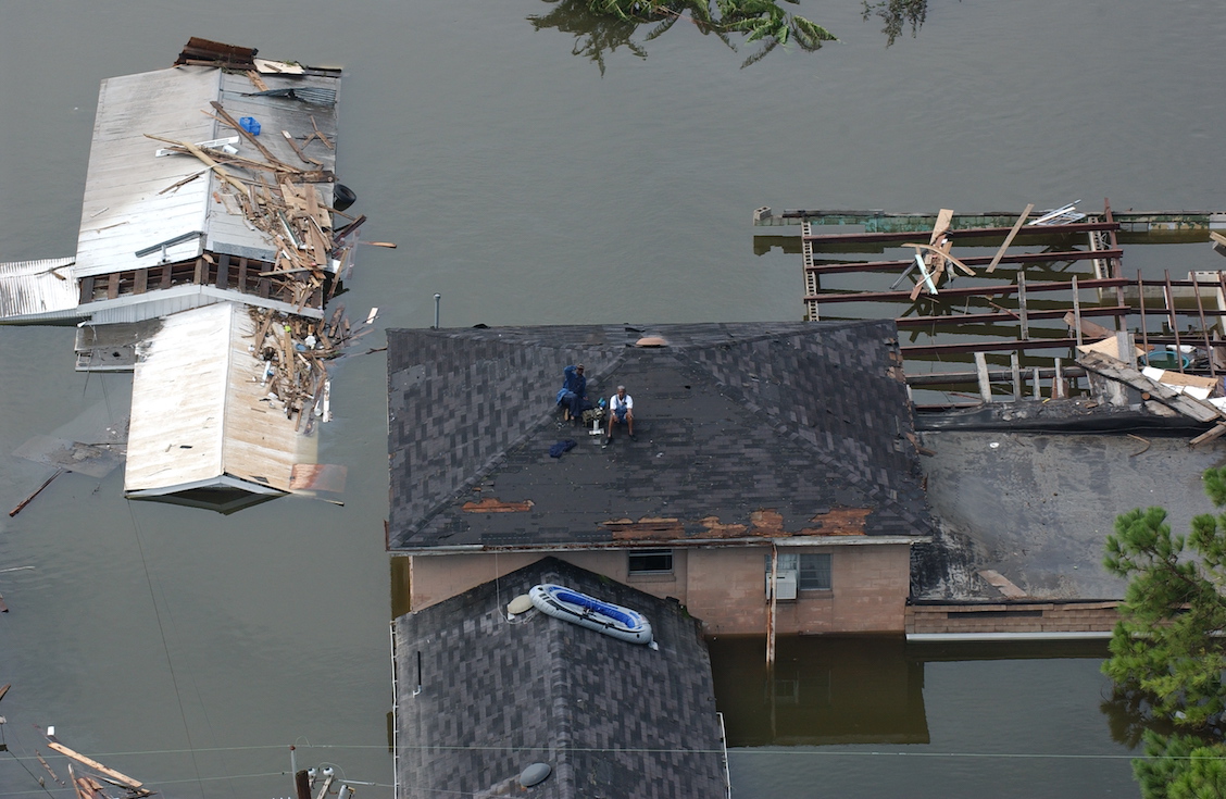 Residents on roof of flooded house in Hurricane Katrina