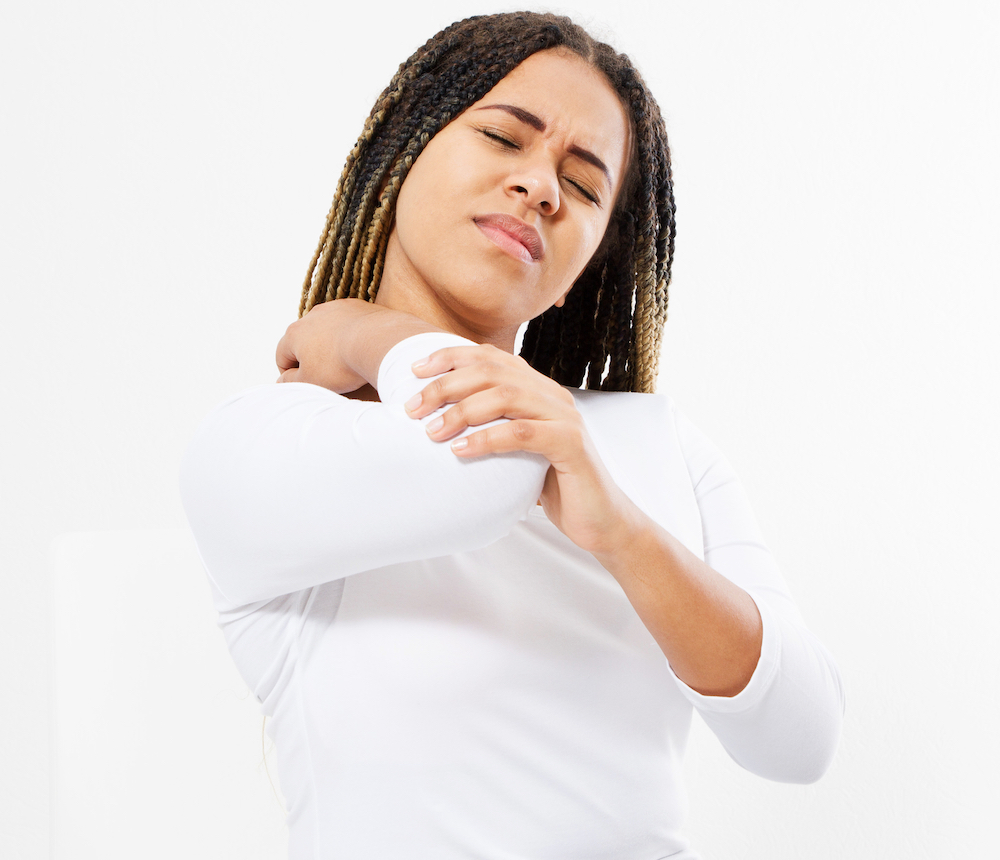 woman in pain using a low dose of naloxone for relief