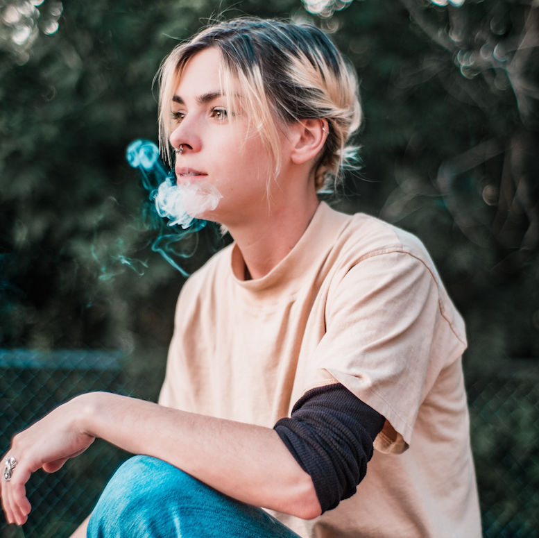 profile of young woman smoking legal weed