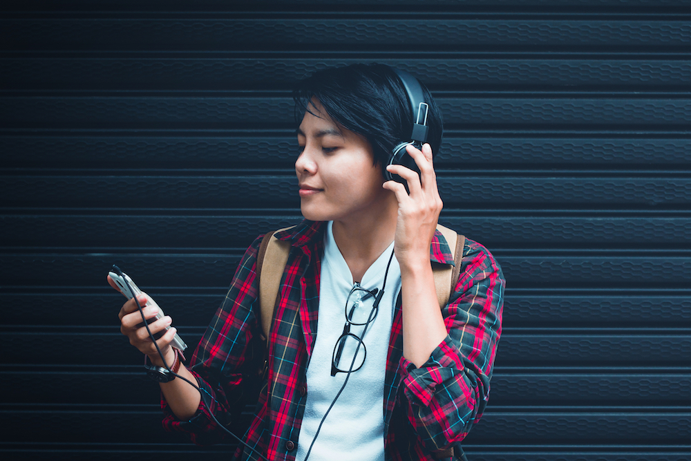teen looking at phone screen