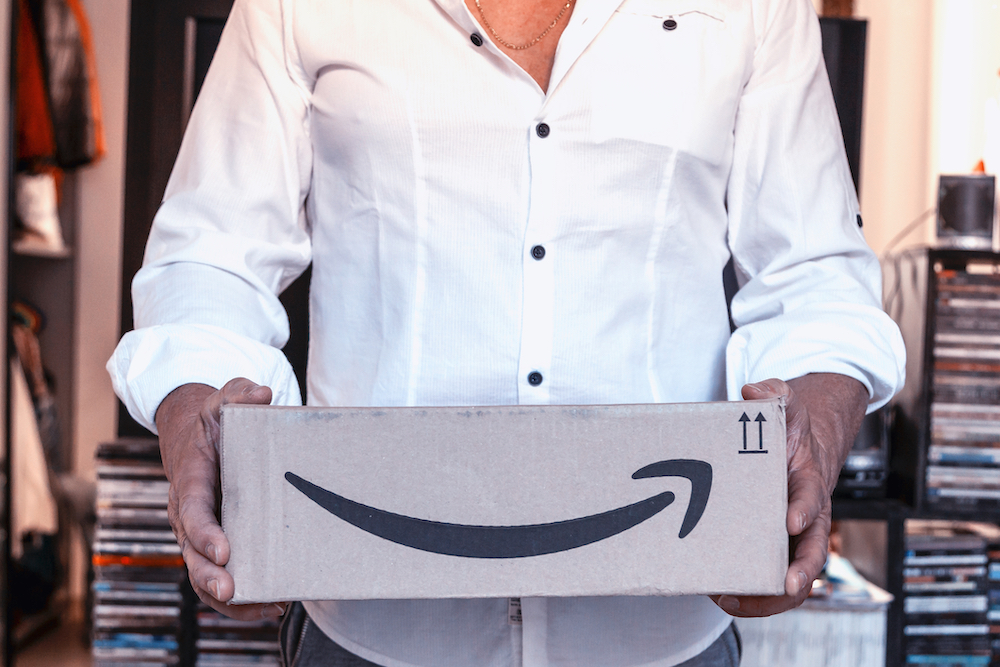 Amazon customer holding a shipment from the company