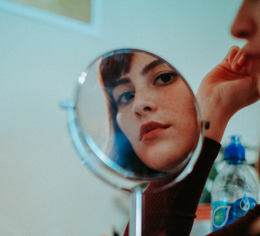 woman's reflection in a mirror