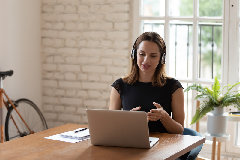 Woman at table with laptop