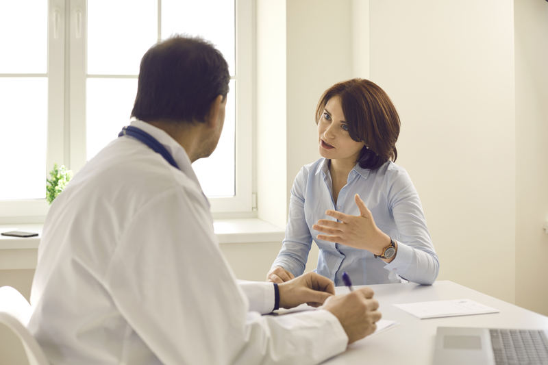 Doctor consulting with patient